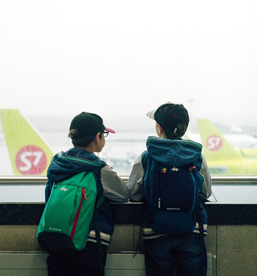 two children at an airport